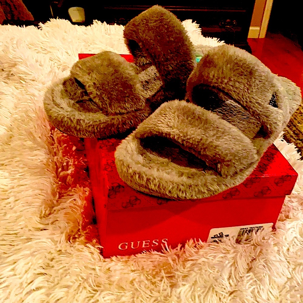 Guess grey faux fur slippers.